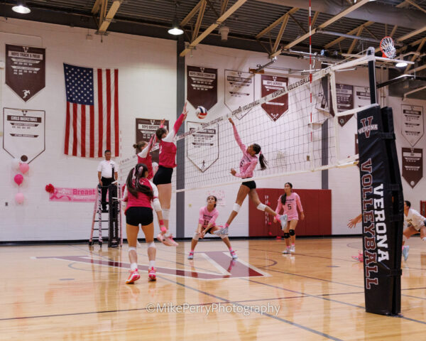 Girls in pink playing volleyball