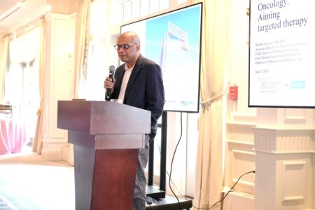 Dr. Ganesan speaking at 2024 May Day Brunch