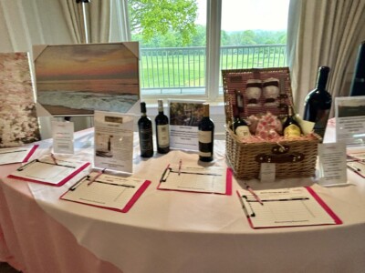 Silent Auction for bottles and artwork at 2024 May Day Brunch